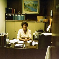 Sue Close at desk in Governor's Office complex